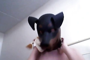 Kinky Girl gets off enervating a rubber dog veil
