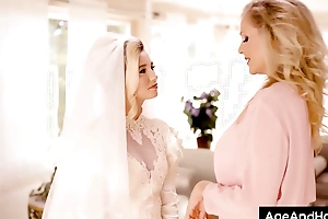 Bride enticed by venerable mother to the fore bridal